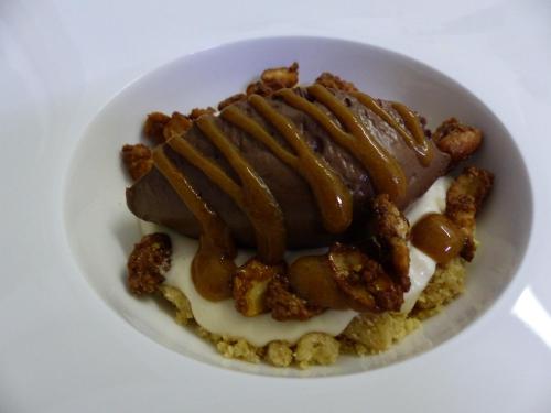 a plate of food with a dessert with caramel at Le Lion d'Or in Selles-sur-Cher