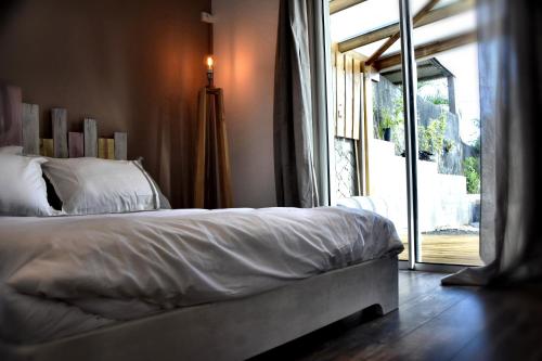Krevet ili kreveti u jedinici u objektu Chez Les Filles - Bungalodge