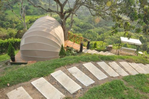 a large boat sitting on top of a hill at Hotel Casa Ambrosia in Villeta