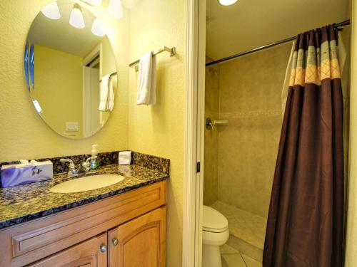a bathroom with a sink and a shower with a mirror at Dockside Condos 602 Waterfront Condo 437 in Clearwater Beach