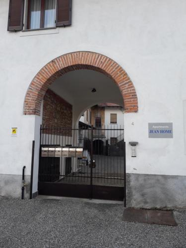an entrance to a building with a black gate at Jean Home in Gallarate