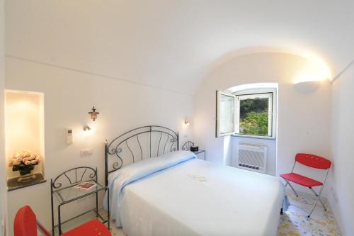 Ένα ή περισσότερα κρεβάτια σε δωμάτιο στο Relais San Basilio Convento