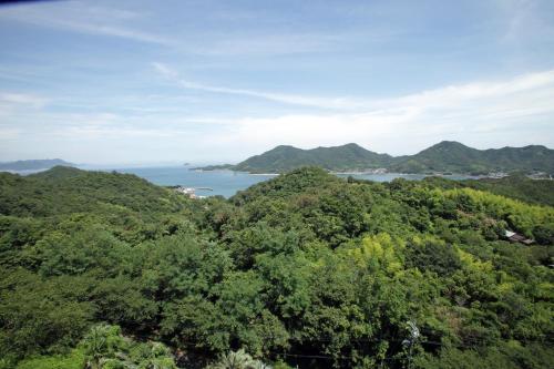 a view of the ocean from the top of a mountain at Hotel Innoshima in Onomichi