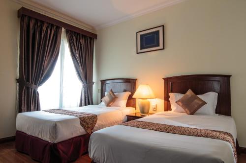 Postel nebo postele na pokoji v ubytování Beta Service Apartment