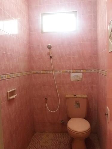 Ванная комната в La Javanaise Home Stay Malioboro