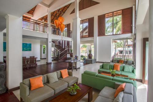 a large living room with couches and a table at Blue Ocean Resort in Mui Ne