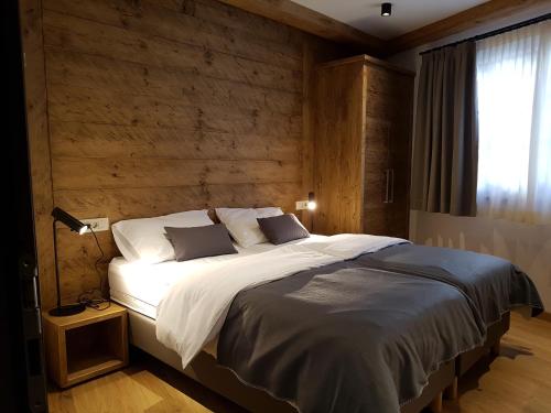 Un pat sau paturi într-o cameră la Hotel Vandot