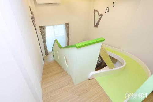 a bathroom with a toilet in the middle of a room at Happiness Yes Inn in Luodong