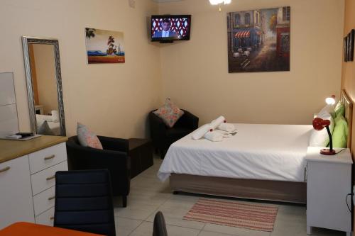 Postel nebo postele na pokoji v ubytování Capbon Guesthouse