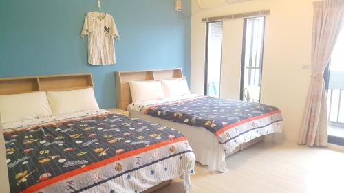 Katil atau katil-katil dalam bilik di Sports Home