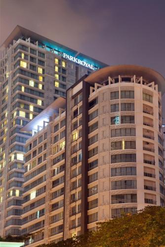 a large building with a sign on top of it at PARKROYAL Serviced Suites Kuala Lumpur in Kuala Lumpur