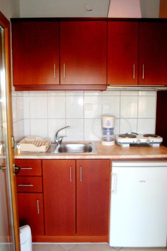 Η κουζίνα ή μικρή κουζίνα στο Simos Apartments