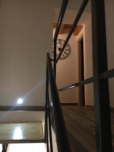 a staircase in a room with a table and a chair at Casa Busari in Palermo