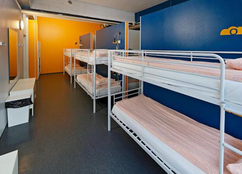 a room with a bunch of bunk beds at CheapSleep Hostel Helsinki in Helsinki