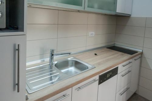 a kitchen with a sink and a counter top at Apartment Ada in Belgrade