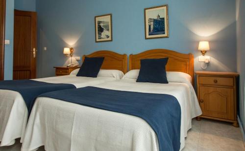 Giường trong phòng chung tại Hotel Villa del Son