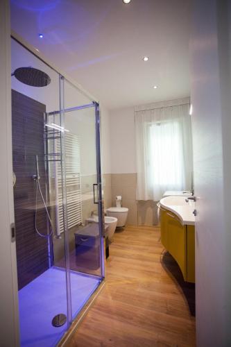 a bathroom with a shower and a sink and a toilet at Residence Torino in Chioggia