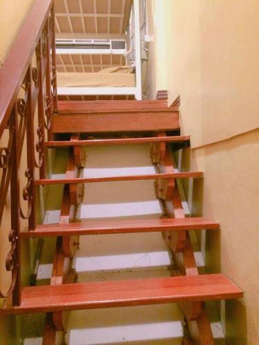 a set of stairs leading up to a door at Anya House in Thongsala