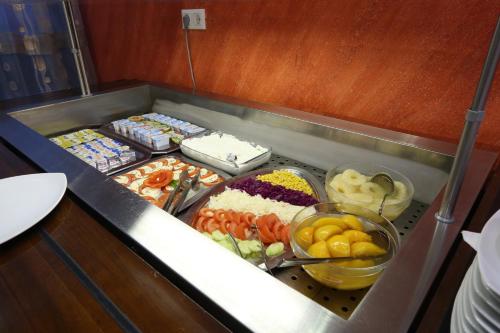 a buffet with many different types of food at Hotel Zenica in Zenica