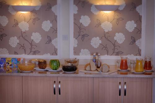 a counter with many different types of food on it at Luccombe Manor Country House Hotel in Shanklin