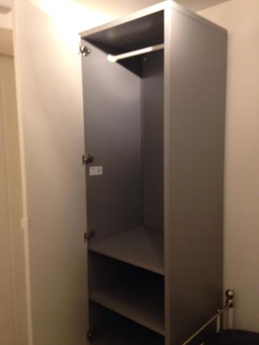 a walk in closet with a glass door at Oxford Studios in Kidlington
