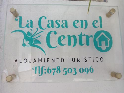 a sign for the la casa end centre inunciinia at La Casa en el Centro in Écija