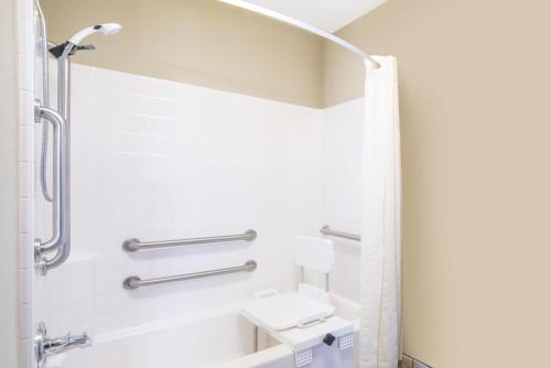 a bathroom with a shower and a sink at Hawthorn Suites by Wyndham Williston in Williston