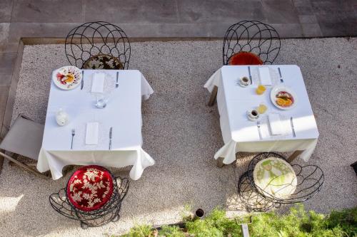 an overhead view of two tables with food on them at Shalai - Exclusive SPA and small gourmet hotel in Linguaglossa