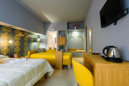 a hotel room with two beds and a television at Un B&B al Belvedere in Enna