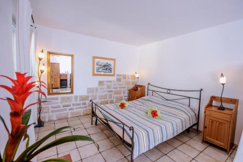 Postel nebo postele na pokoji v ubytování Hotel Skalinada