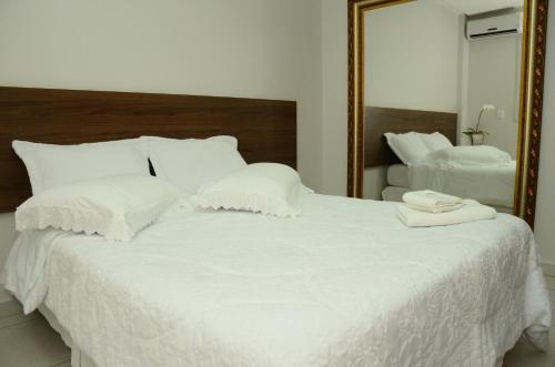 Posteľ alebo postele v izbe v ubytovaní Hotel Flamboyant
