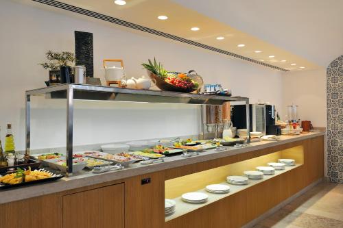 a buffet line with a lot of food on display at Vincci Baixa in Lisbon