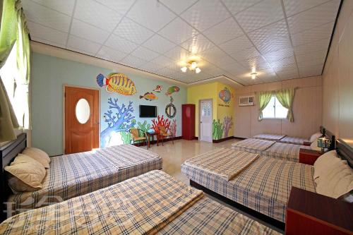 Postel nebo postele na pokoji v ubytování Green island Breeze Homestay