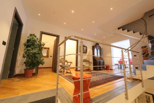 a living room with a staircase and a stair case at Kalos Relais in Catanzaro