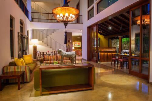 a living room with a couch and a table at Zylan Colombo in Colombo