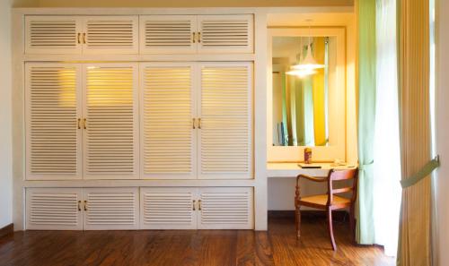 a large white closet with a desk and a mirror at Zylan Colombo in Colombo