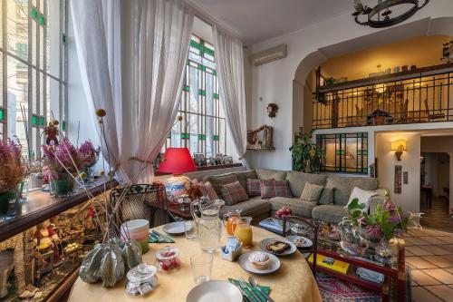 a living room with a couch and a table at Weekend a Napoli in Naples