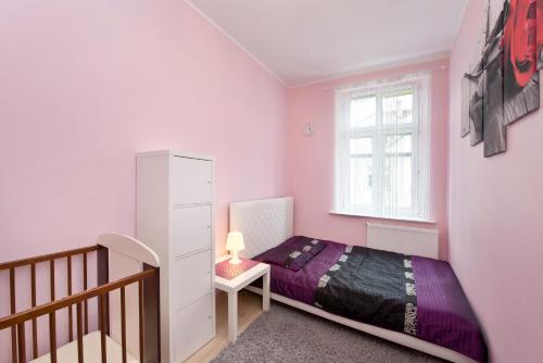 Posteľ alebo postele v izbe v ubytovaní Apartament Miami