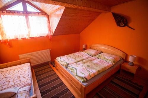 Posteľ alebo postele v izbe v ubytovaní Penzion HACIENDA
