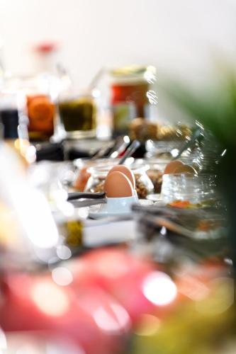 a table full of food with eggs and other foods at Gkeea Boutique Hotel in Ierissos