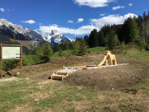 a polar bear standing on a slide in a field at Apartment Krämerhaus Annaberg, Dachstein West in Annaberg im Lammertal