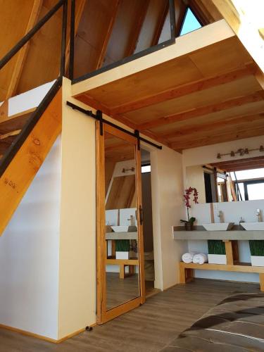 a room with an open door in a house at Ixchel Glamping Valle de Guadalupe in Ensenada