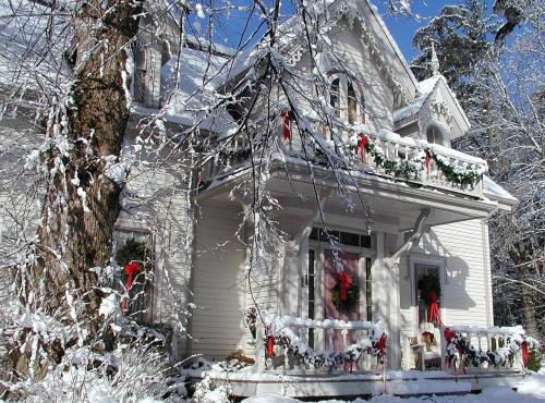 a white house with christmas wreaths on it at Briarwood Bed & Breakfast in Elmsdale