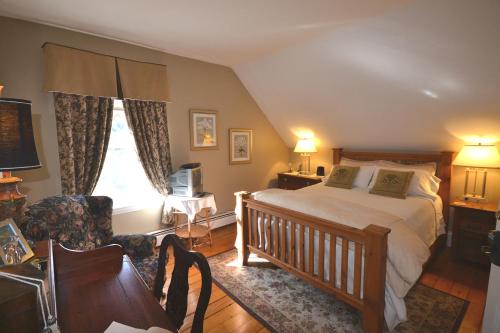 a bedroom with a bed and a desk and a chair at Briarwood Bed & Breakfast in Elmsdale