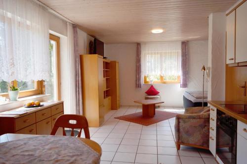 a room with a kitchen and a living room at Ferienappartement Möbius in Aulendorf