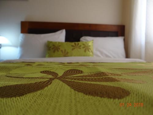 Postel nebo postele na pokoji v ubytování Hotel Mac Arthur