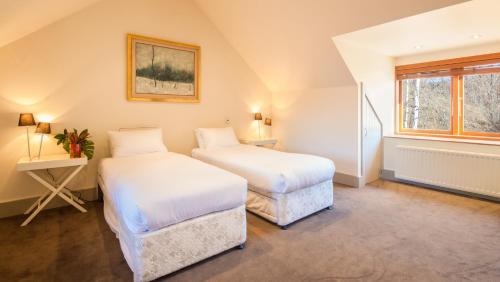 Ένα ή περισσότερα κρεβάτια σε δωμάτιο στο Wharenui Holiday Home by MajorDomo
