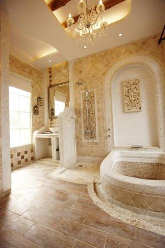 a large bathroom with a tub and a sink at My Chateau Resort in Kenting