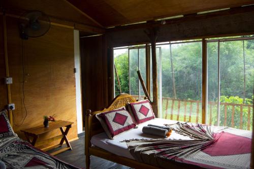 Ένα ή περισσότερα κρεβάτια σε δωμάτιο στο Nera Nature House