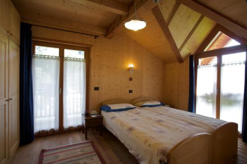 Postel nebo postele na pokoji v ubytování B&B Affittacamere Larix